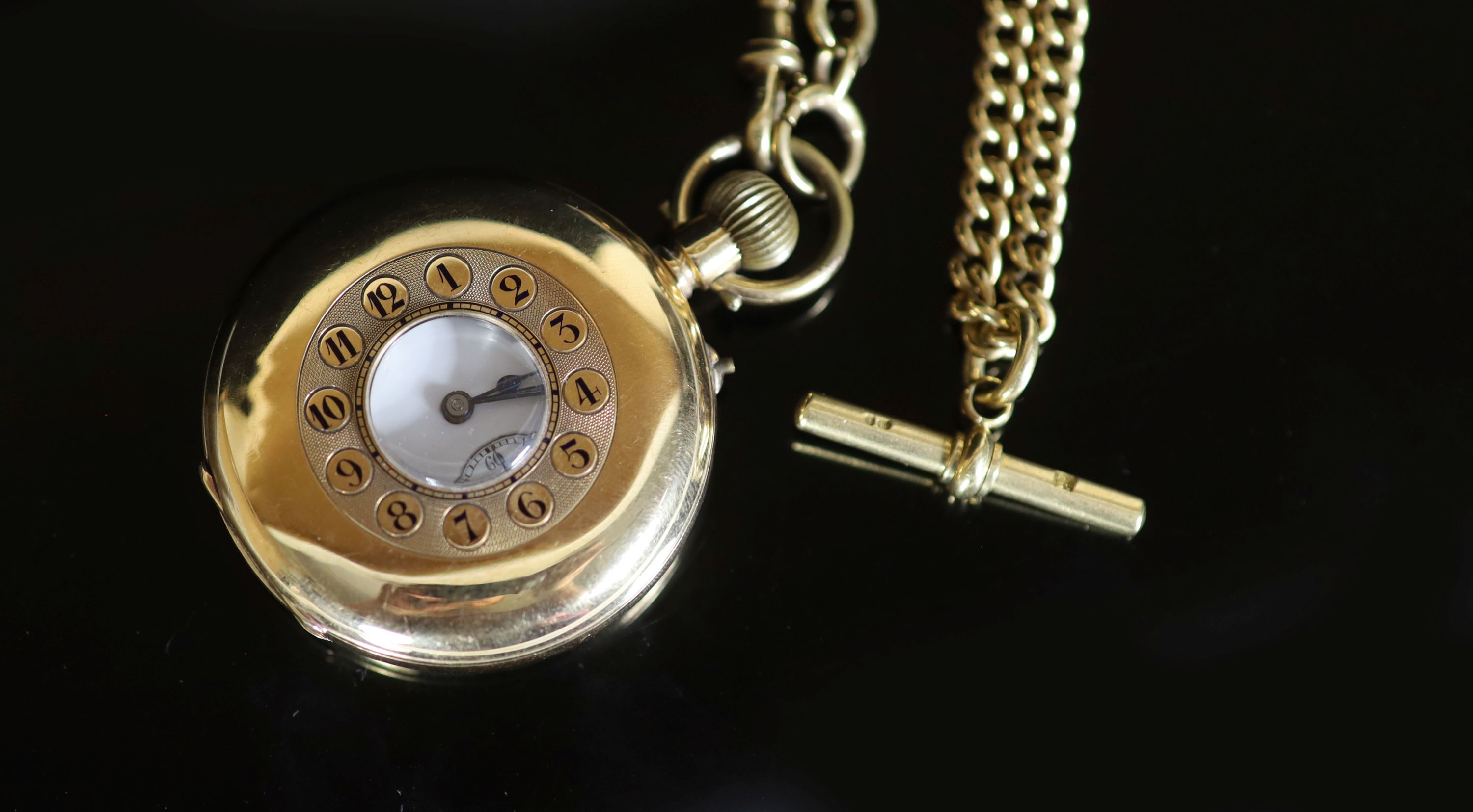 A late 19th/early 20th century 18K gold half hunter keyless pocket watch, by William Greenwood of Leeds, together with an 18ct gold curblink albert